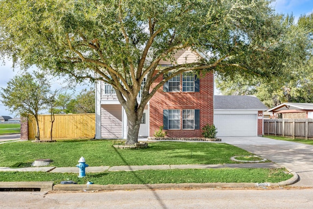 view of front of house featuring a garage and a front lawn