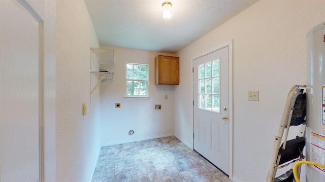 washroom with electric dryer hookup, cabinets, and hookup for a washing machine