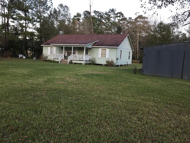 exterior space with a lawn and covered porch