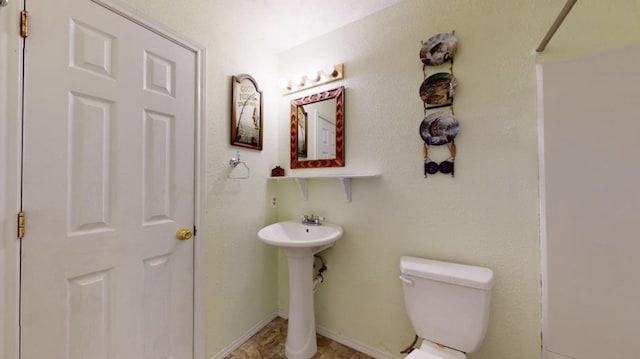 bathroom featuring toilet