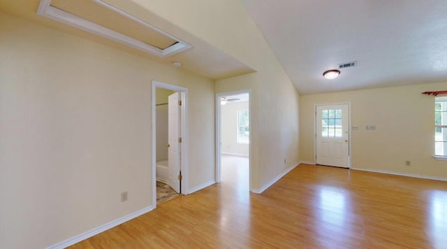 foyer entrance with ceiling fan and light wood-type flooring