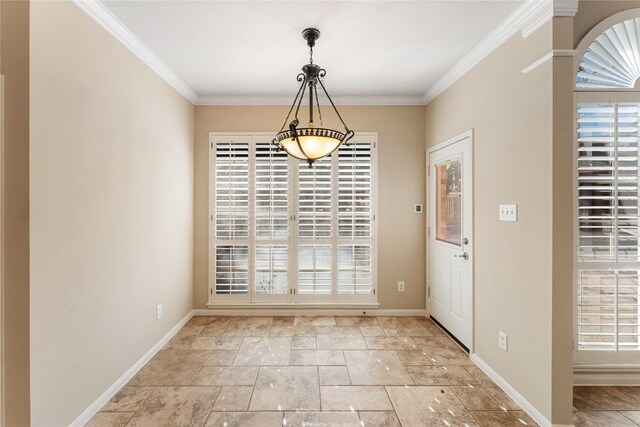 unfurnished dining area featuring ornamental molding