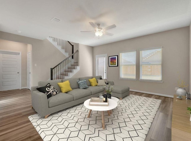 living room with ceiling fan and light hardwood / wood-style flooring