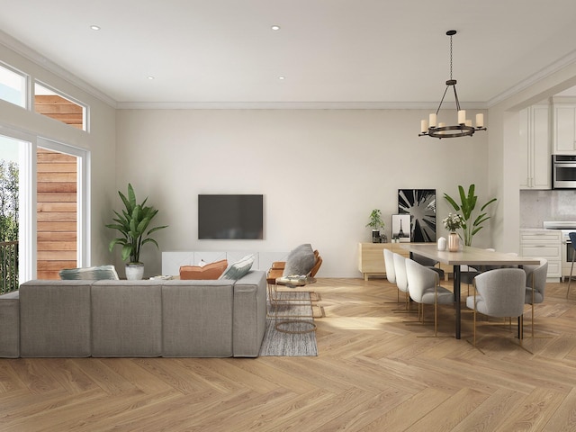 living room featuring a chandelier, crown molding, and light parquet floors