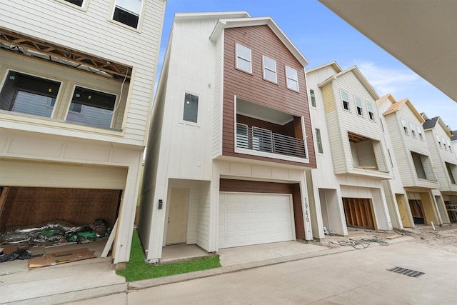 townhome / multi-family property featuring board and batten siding and an attached garage