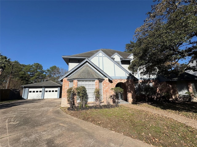 view of front facade featuring an outbuilding and a garage