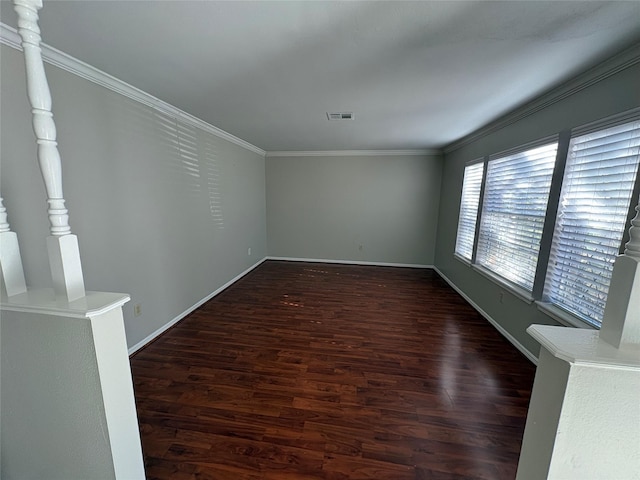 unfurnished room with dark hardwood / wood-style flooring and ornamental molding