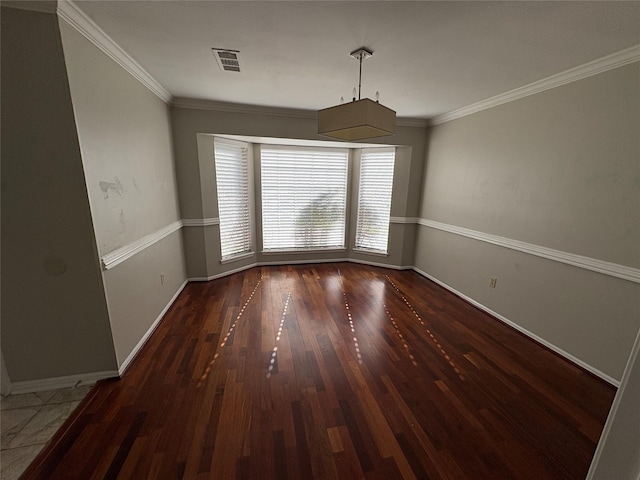 unfurnished dining area featuring crown molding