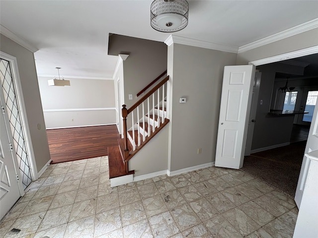 foyer featuring ornamental molding