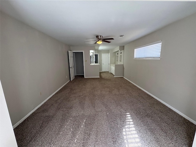 unfurnished living room with carpet flooring and ceiling fan