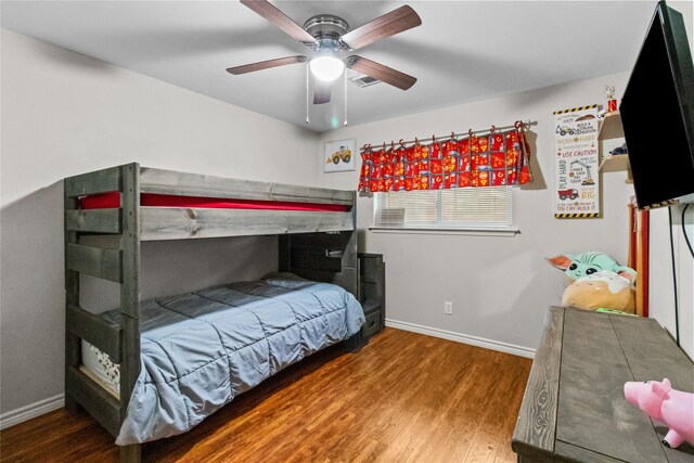 bedroom with ceiling fan and wood-type flooring