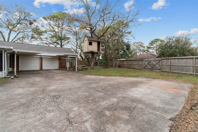 view of property exterior with a yard and a garage