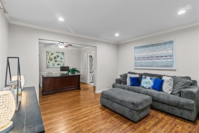 living room with ornamental molding, ceiling fan, and wood-type flooring