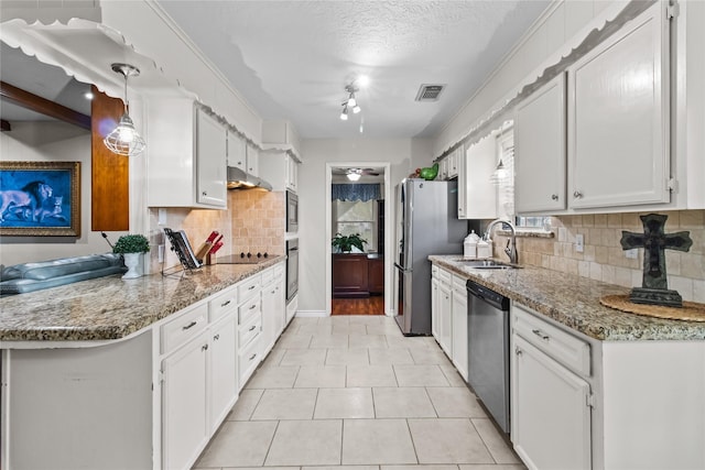 kitchen with black appliances, hanging light fixtures, light stone countertops, sink, and white cabinetry