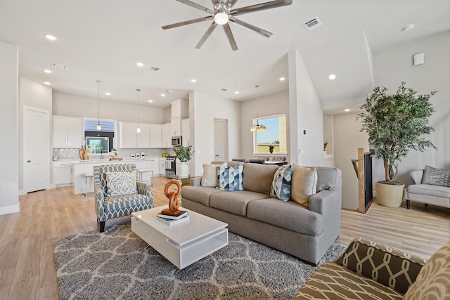 1956 Purswell Rd, Houston, TX 77055 - living area with light wood-style floors, a ceiling fan, and recessed lighting