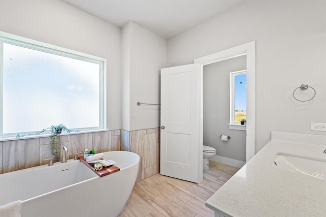 1956 Purswell Rd, Houston, TX 77055 - bathroom featuring a freestanding bath, toilet, and vanity