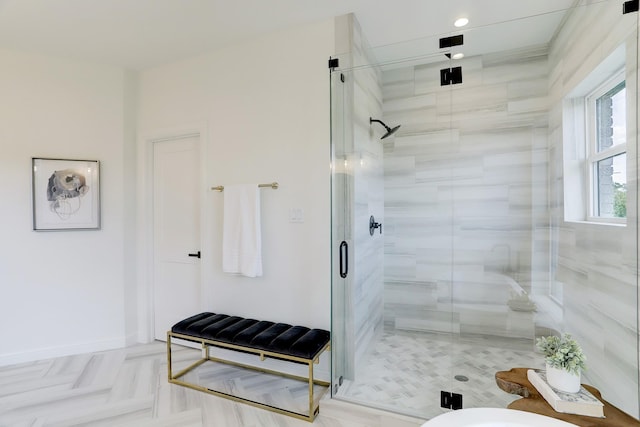 bathroom featuring a shower with shower door and parquet flooring