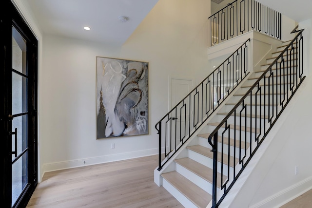 stairway featuring hardwood / wood-style flooring