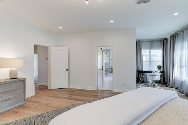 bedroom with light hardwood / wood-style floors