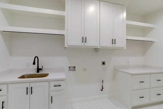 laundry area with cabinets, hookup for a gas dryer, sink, washer hookup, and hookup for an electric dryer