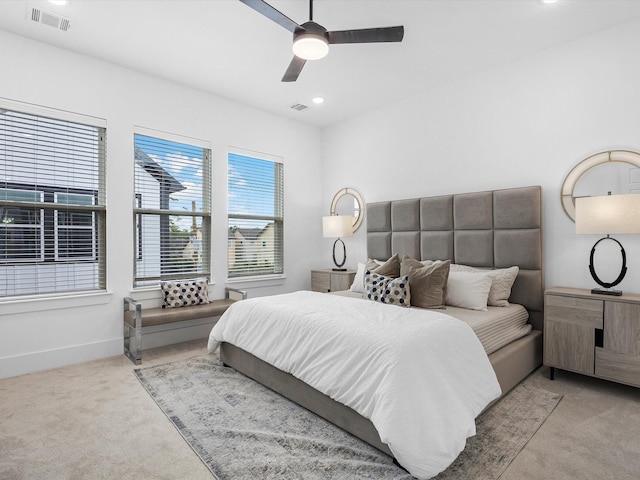 carpeted bedroom featuring ceiling fan