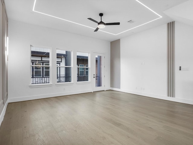 spare room featuring ceiling fan and light wood-type flooring