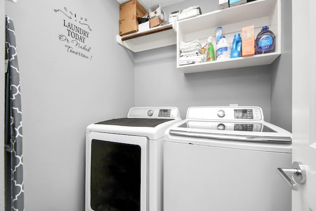 clothes washing area featuring independent washer and dryer