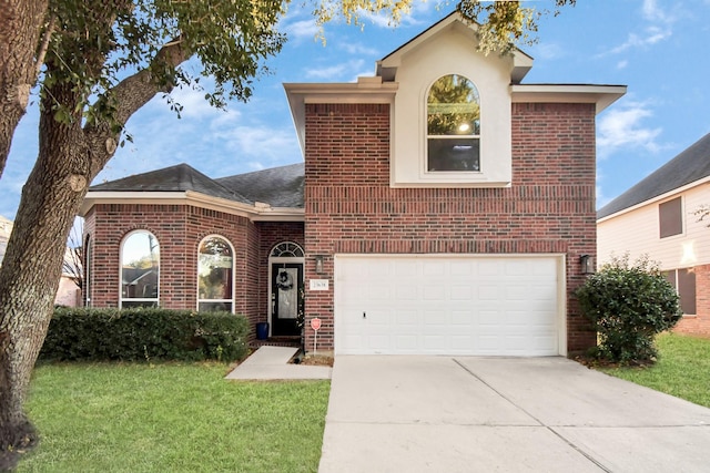 front facade featuring a front lawn and a garage