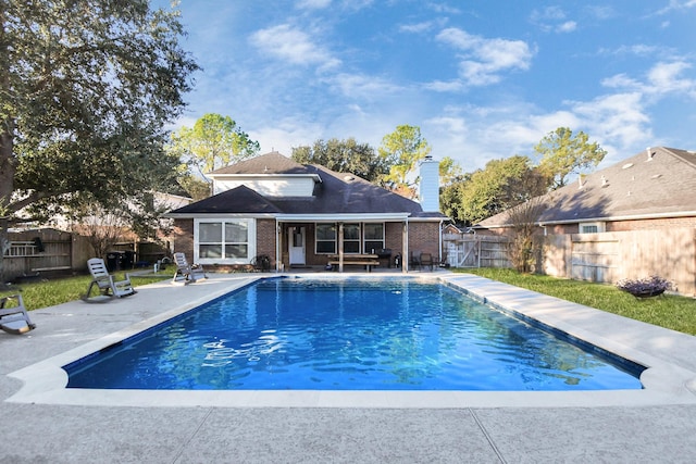 view of pool featuring a patio