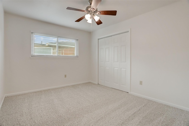 unfurnished bedroom featuring carpet flooring, a closet, and ceiling fan