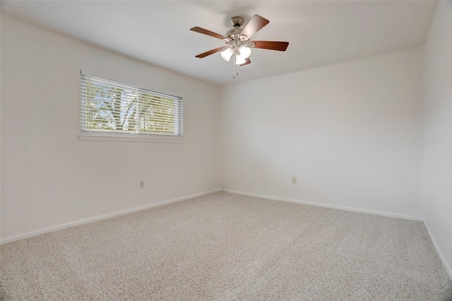 spare room with carpet and ceiling fan