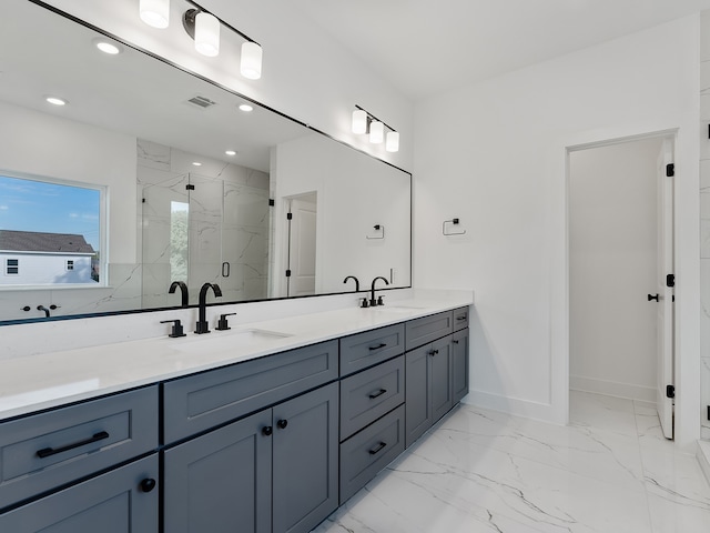 bathroom featuring vanity and an enclosed shower