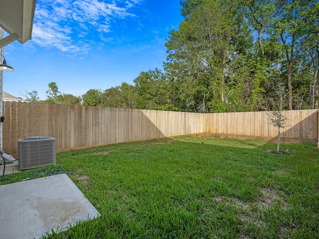 view of yard with central AC