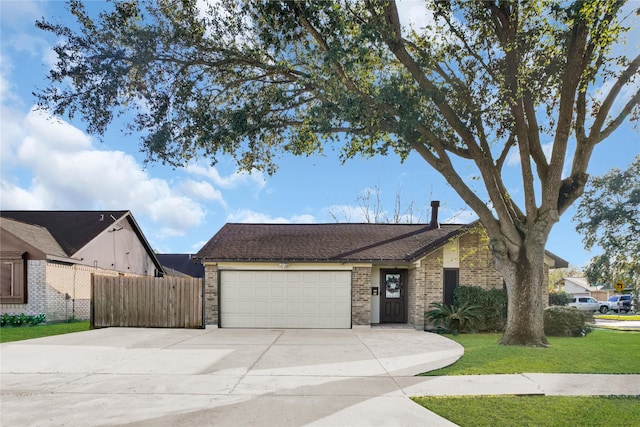 ranch-style house with a front lawn and a garage