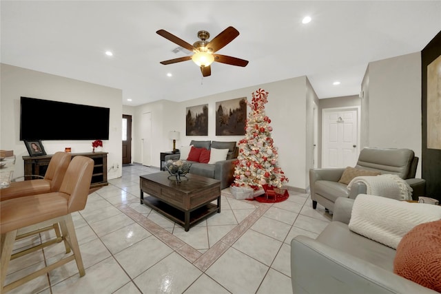 tiled living room featuring ceiling fan