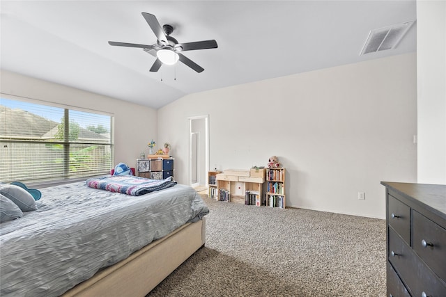 carpeted bedroom with vaulted ceiling and ceiling fan