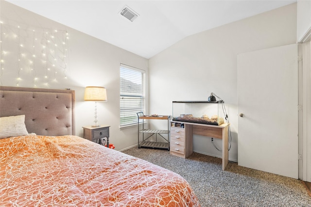 carpeted bedroom with vaulted ceiling