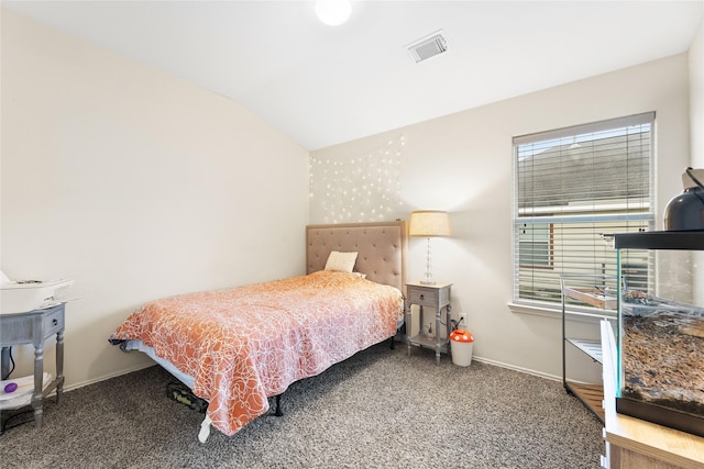 carpeted bedroom featuring vaulted ceiling