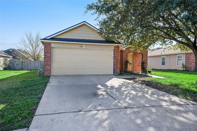 single story home with a front yard and a garage