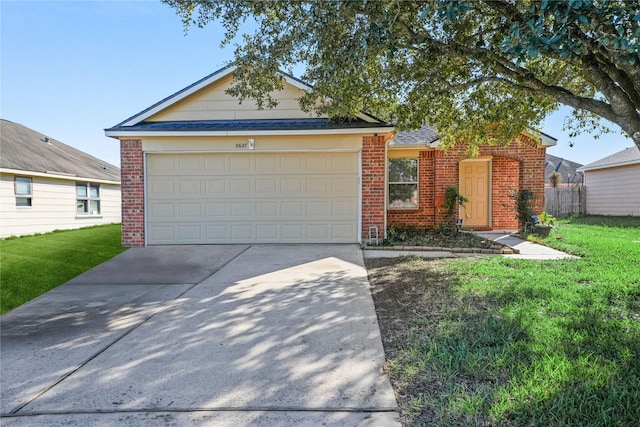 ranch-style home featuring a front yard and a garage