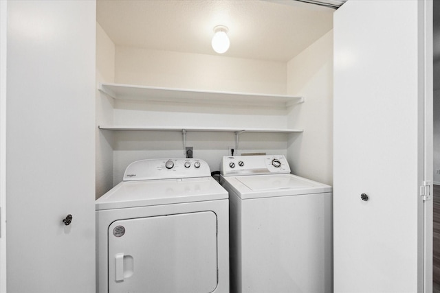 washroom with washing machine and dryer