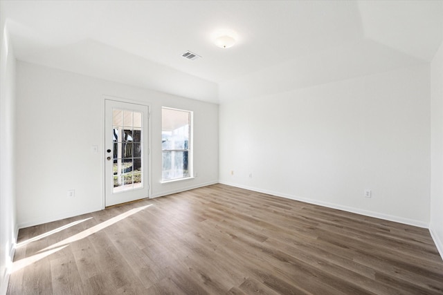 spare room featuring hardwood / wood-style floors