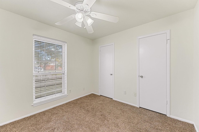 unfurnished bedroom with carpet and ceiling fan