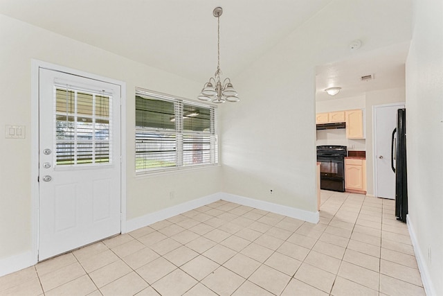 unfurnished dining area featuring an inviting chandelier and light tile patterned flooring