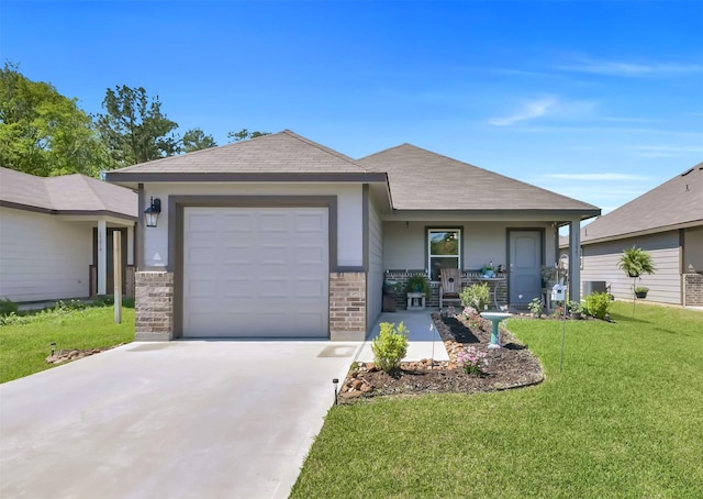 single story home featuring covered porch, a front yard, and a garage