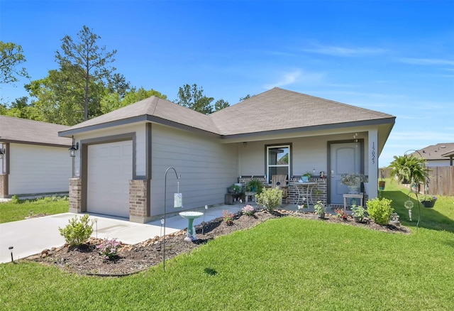 single story home featuring a porch, a garage, and a front yard