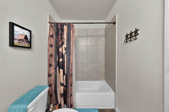 bathroom featuring shower / tub combo, a textured ceiling, and toilet