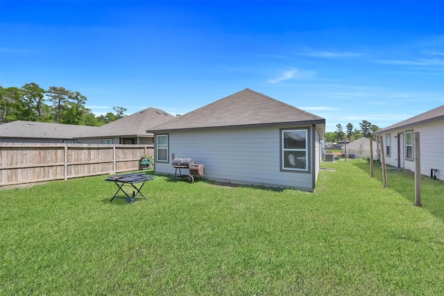 back of property featuring a lawn