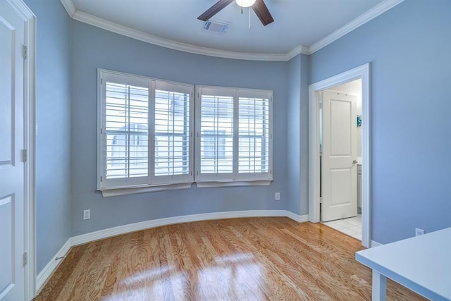 unfurnished room with light hardwood / wood-style floors, ceiling fan, and ornamental molding