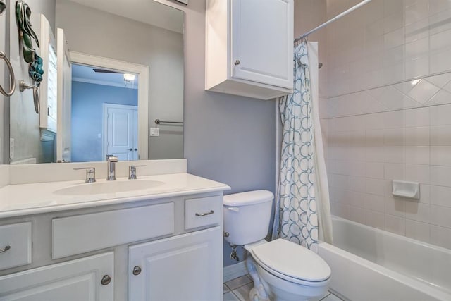 full bathroom with tile patterned floors, vanity, toilet, and shower / bath combo with shower curtain